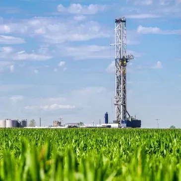 Drilling rig in agricultural landscape